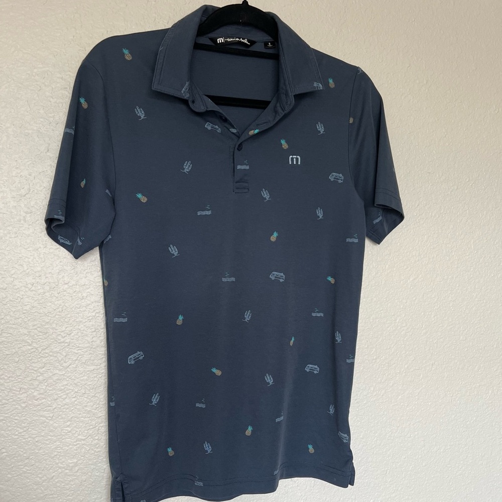 Travis Mathew Navy Polo with Teal Pineapple & Light Blue Accents
